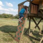 Backyard Discovery Eagles Nest Cedar Wooden Playhouse Playset with 7-Foot Crow's Nest Wave Slide and Rock Climbing Wall - Image 4