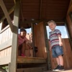 Backyard Discovery Eagles Nest Cedar Wooden Playhouse Playset with 7-Foot Crow's Nest Wave Slide and Rock Climbing Wall - Image 5
