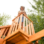 KidKraft Ridgemoor Perch Cedar Wood Outdoor Swing Set with Slide and Rock Wall - Image 3